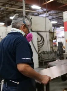 man grinding metal